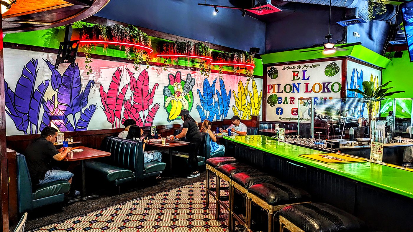 Bar and booth seating with colorful murals