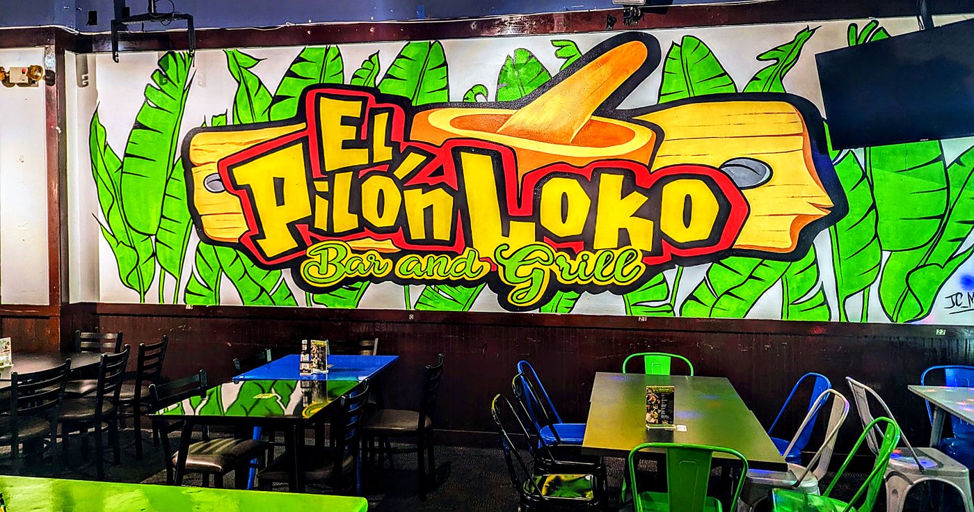 Painted logo mural over the dining room